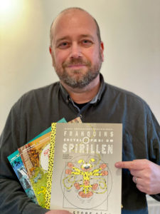 Klaus Sommer Paulsen holding Marsupilami comic books